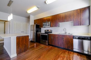 kitchen with stainless steel appliances and custom cabinetry at Elan Redmond luxury apartments